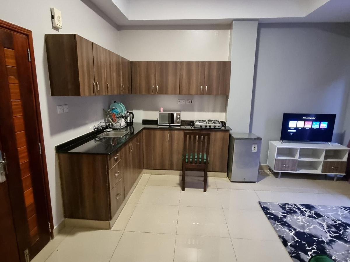 Eika Suites At Acacia Кампала Экстерьер фото